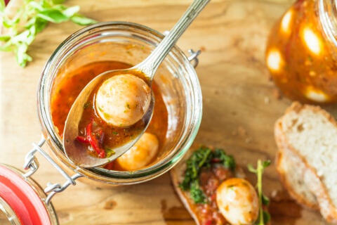 a soup with quail eggs and chili