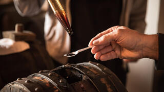 balsamic vinegar taken from barrel and served on a spoon