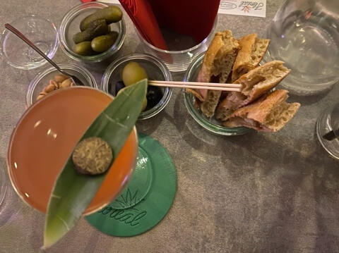 aperitivo with cocktail and bar snacks