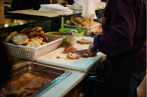 Market trader slicing lampredotto