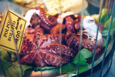 boiled octopus for sale at a market