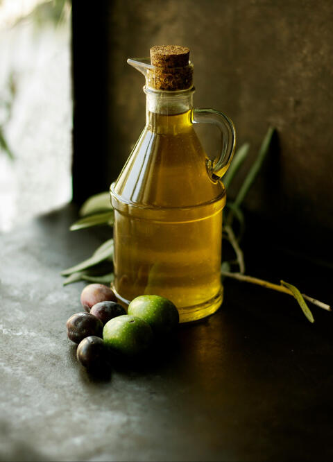 bottle of oil with olives