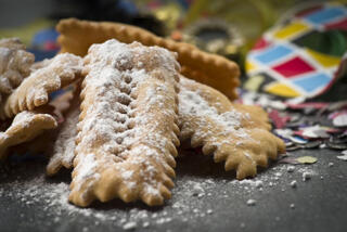 chiacchiere dusted with icing sugar.