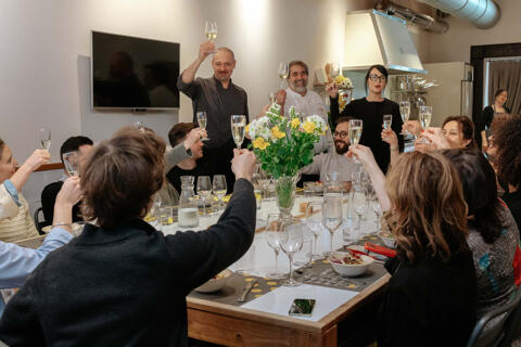 group of colleagues cheers with prosecco