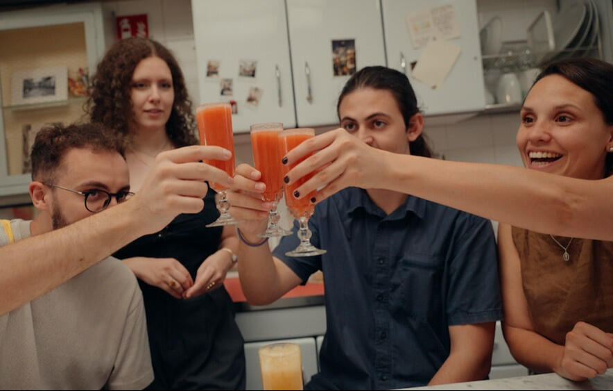 cheers with bellini cocktail