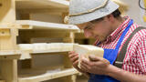 man smelling cheese