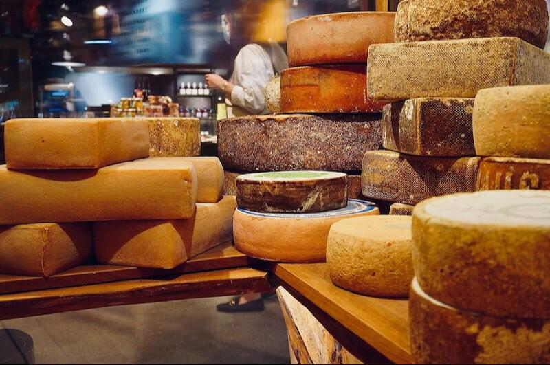 selection of cheese wheels displayed