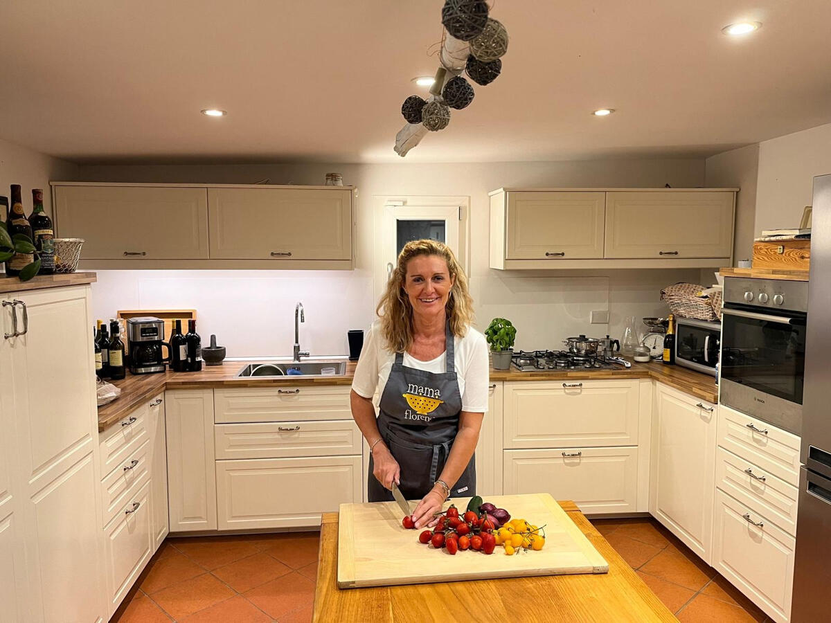 chef slicing vegetables in kitchen