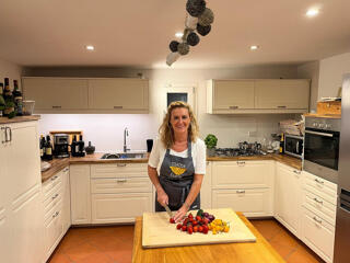 chef slicing vegetables in kitchen