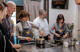 Chefs and students cooking in Tuscan cooking class