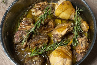 chicken stew with rosemary in pan