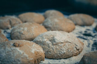 raw pizza dough dusted with flour.