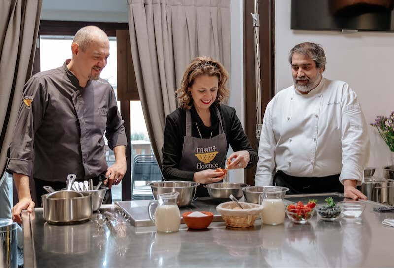 mama florence chefs with student cooking together