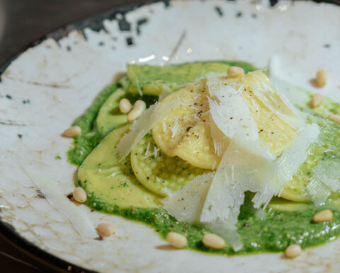 corzetti pasta with pesto parmesan and pine nuts