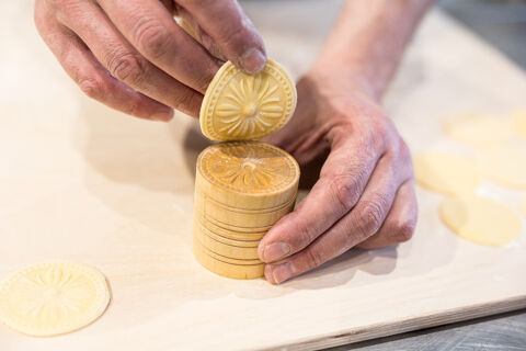 corzetti stamp with fresh corzetti pasta made by hand