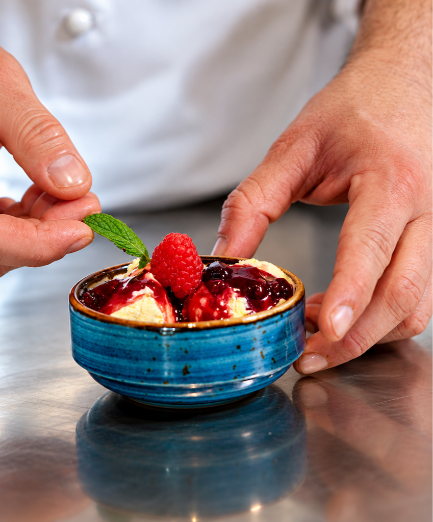 cream gelato with berry sauce