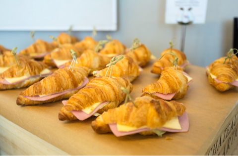 savoury croissants with ham and cheese in a bakery