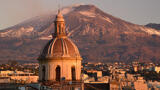 mount etna with town in foreground