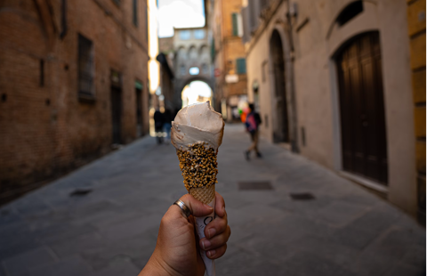 gelato cone in hand in an italian street