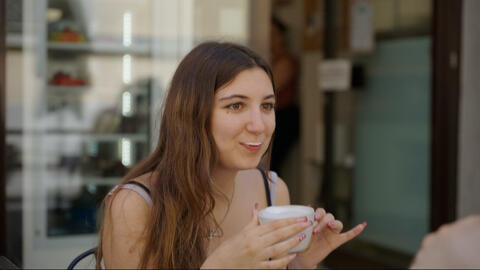 girl drinking a cappuccino