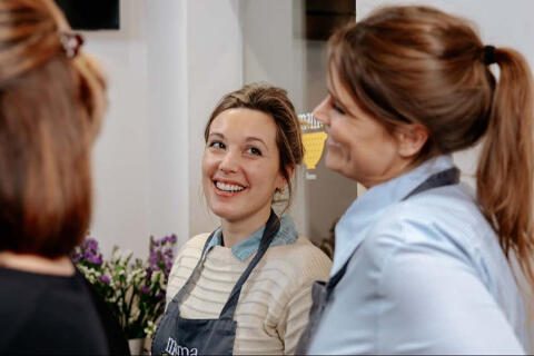 girls laughing in olive oil tasting