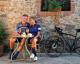 couple having an aperitivo after bike ride with bikes in background