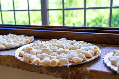 raw handmade gnocchi displayed on a plate