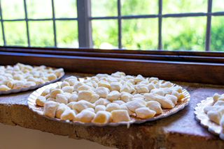 raw handmade gnocchi displayed on a plate