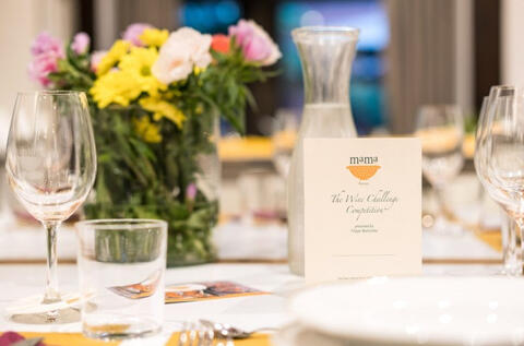 set dining table with flowers and mama florence menu