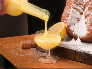 limoncello poured into a glass with pandoro