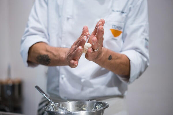 make dough balls by rubbing your hands against each other