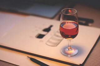 single glass of wine set on table