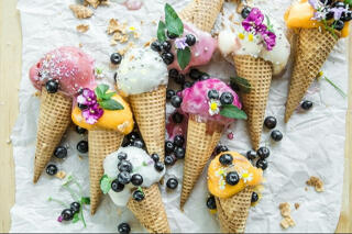 selection of colored ice creams in cones