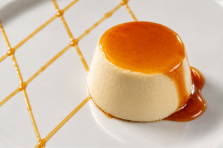 panna cotta with ginger sauce and candied ginger