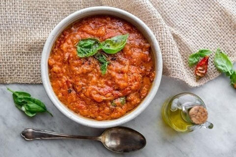 pappa al pomodoro served in a bowl with spoon
