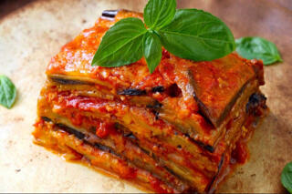 eggplant parmigiana served with basil