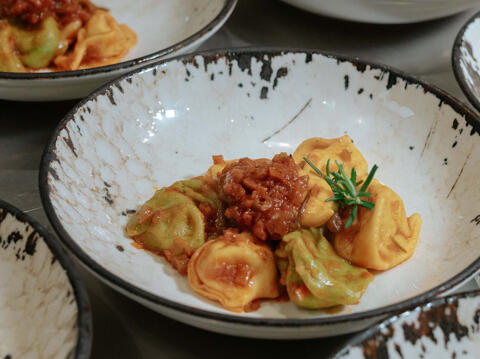 fresh tortelli pasta with meat ragu