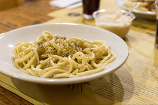 pici pasta served with black pepper