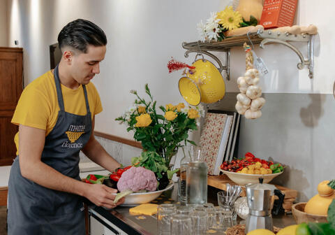 mama florence server arranging display in kitchen