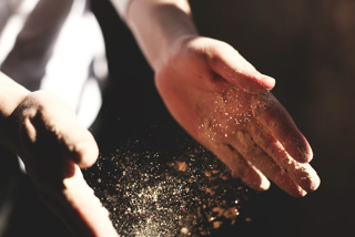 hands covered in flour