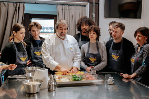 group of students watching chef demonstration.