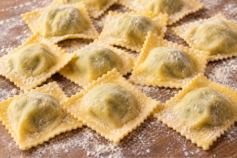 ravioli served with rosemary sauce in a bowl