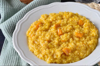 pumpkin risotto served in a white bowl