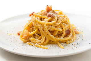 Carbonara pasta on a plate.