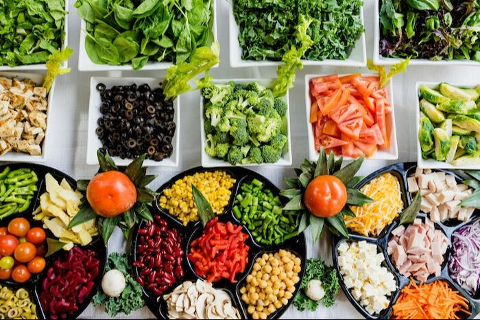 mixed salad section in bowls