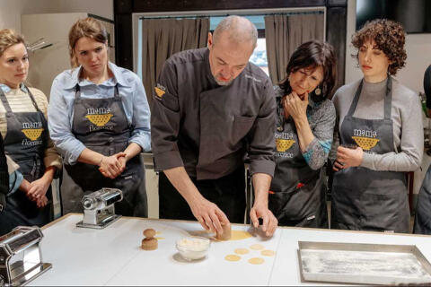 Chef makes handmade corzetti pasta with students