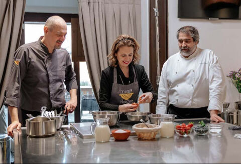student in class with two chefs