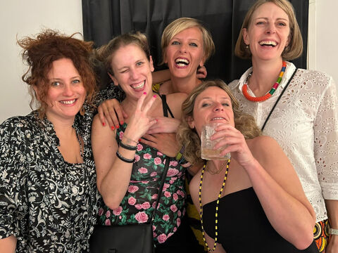 group of friends smiling and posing for a photo