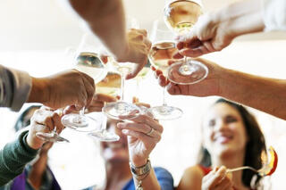 Group cheers with white wine