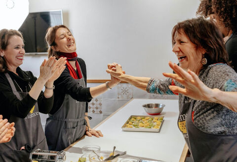 three women celebrate in team building activity